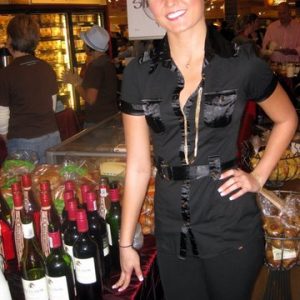 Brand Besties promo model serves at a liquor tasting